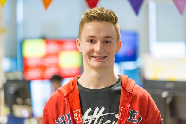 Peter Hartshorn, First Year Digital, data and Technology Fast Tracker standing in front of a camera, smiling