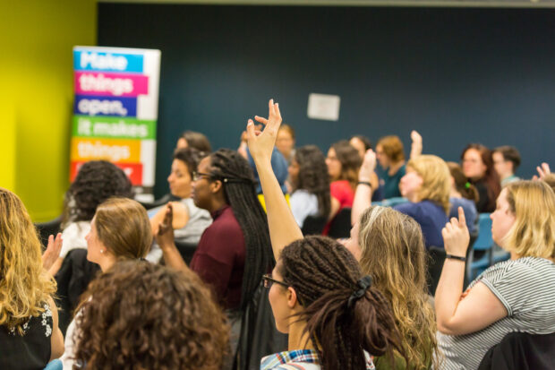 Ladies of Code meetup and audience raising hands for questions