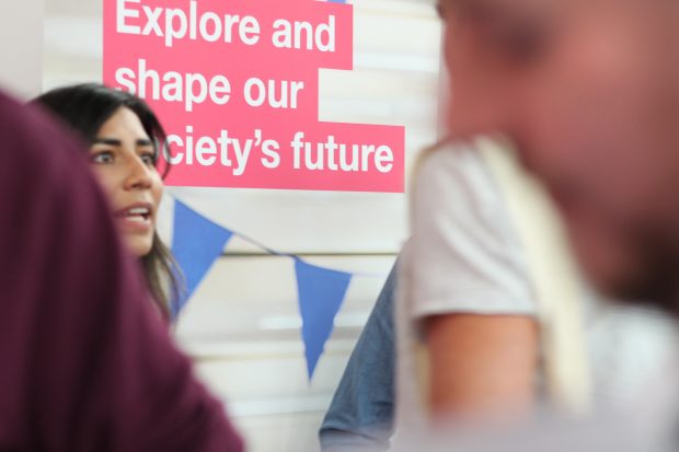 Cross government stand at the tech job fair, May 2018. A banner behind reads "Explore and shape our society's future"