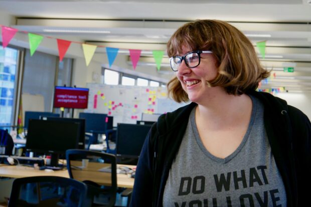 Liz Lutgendorff smiling away from camera at the GDS offices