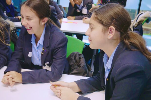 Two students smiling in a class at the Government Digital Service Career Insight Day