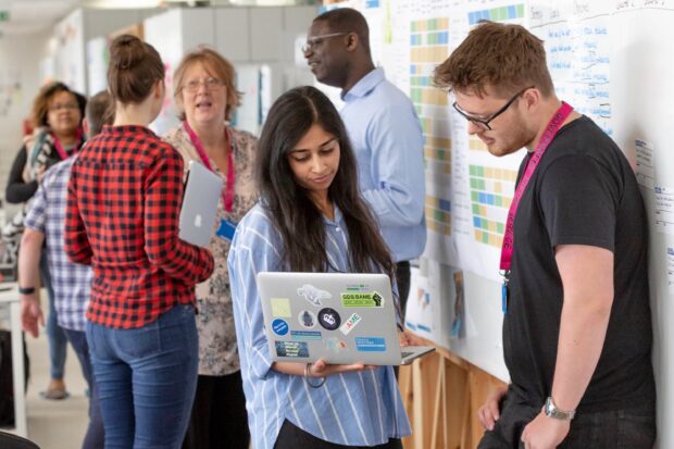 Digital, Data and Technology Profession Team talking to each other