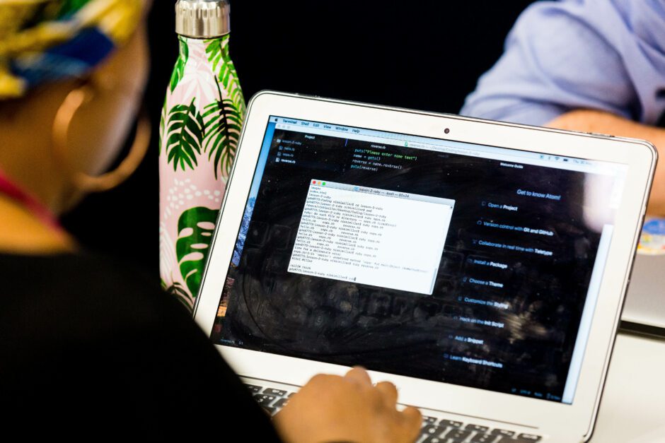 Womens coding on laptop