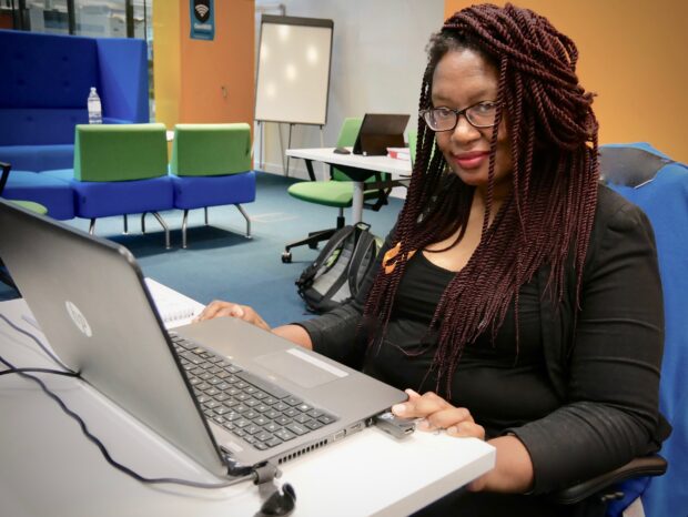 Yvonne Mqadi, facing the camera and smiling