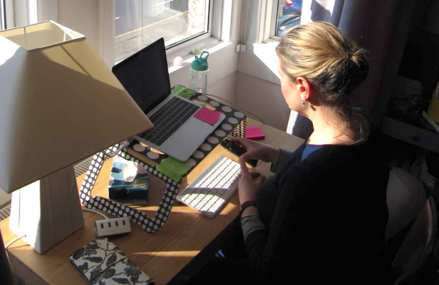 Picture of Liz working from her desk at home