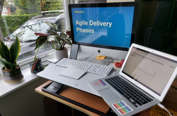 Photo of a laptop screen showing a presentation on Agile Delivery