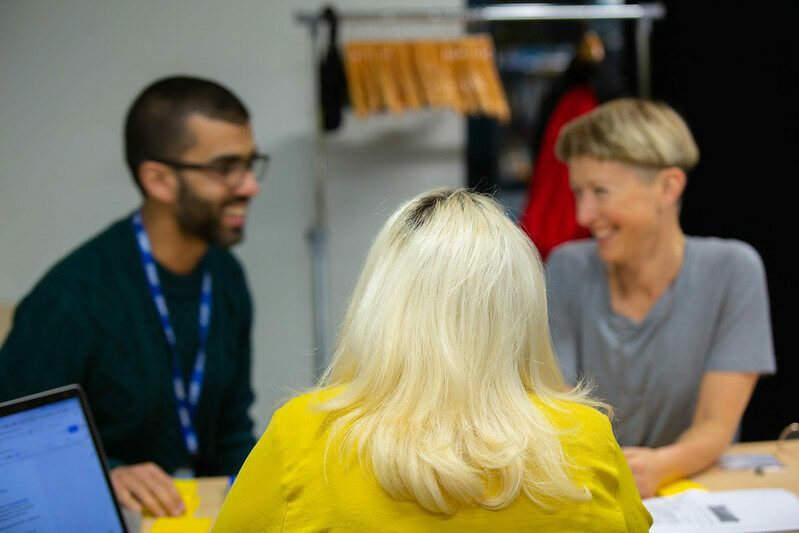 Three colleagues chatting