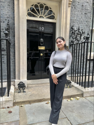 Image shows the author standing outside No10 Downing Street